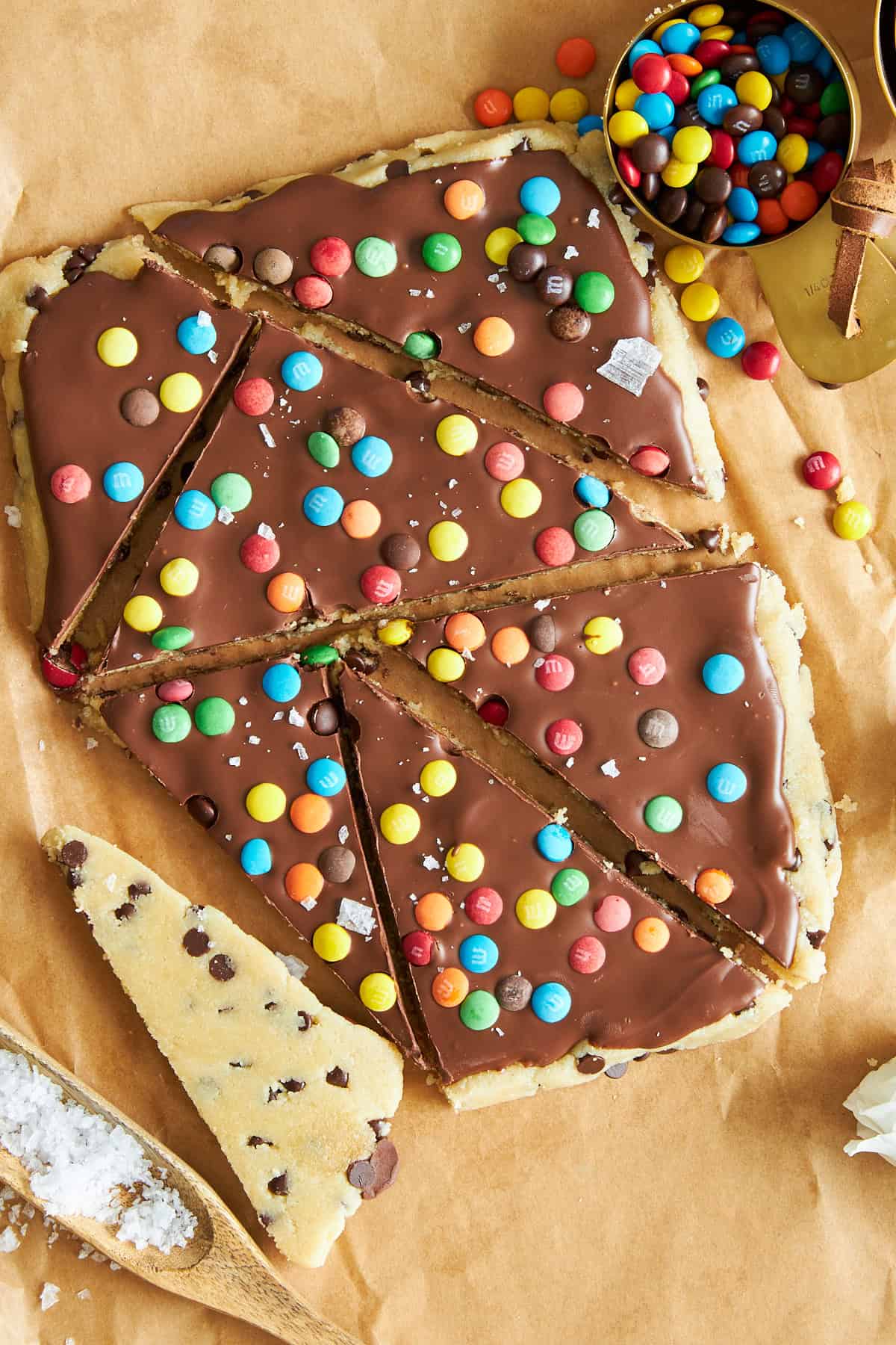 Cookie dough bark topped with chocolate and mini m&ms. 