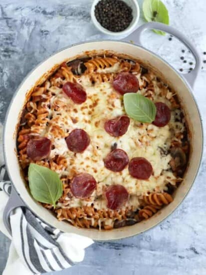 overhead image of cooked pizza pasta topped with melted broiled cheese and pepperonis