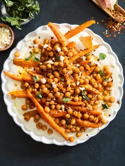 A plate of chickpeas and roasted carrots with whipped feta.