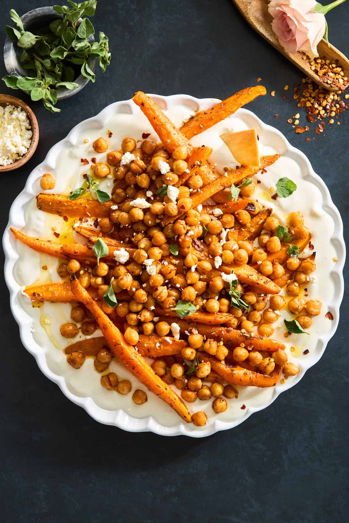 A plate of chickpeas and roasted carrots with whipped feta.