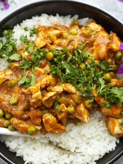 overhead madras curry chicken in a pan