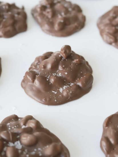 chocolate peanut slow cooker candy clusters topped with salt