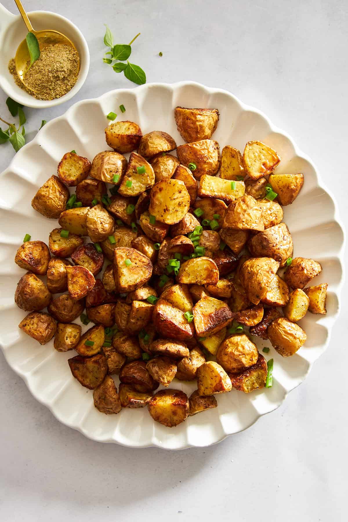 A plate of air fryer Greek potatoes. 