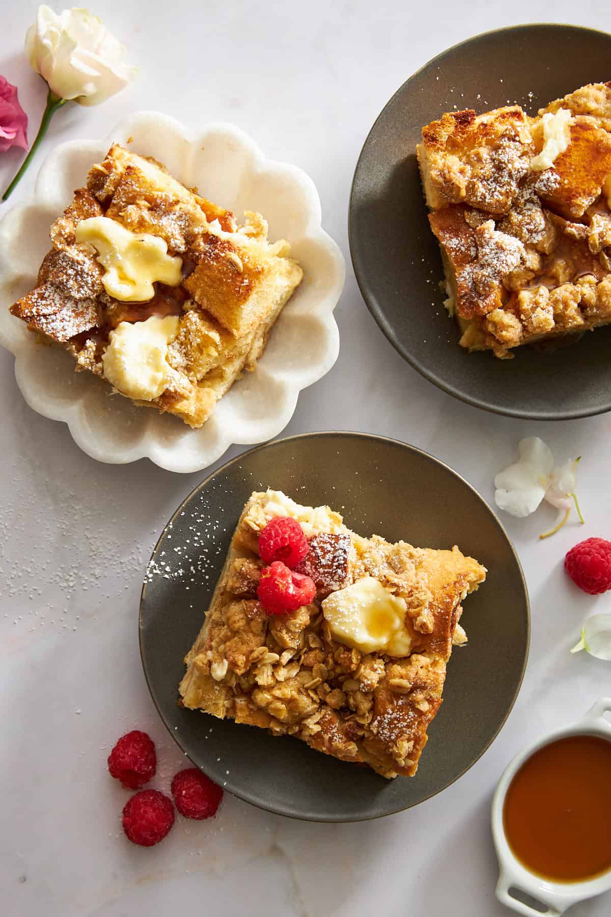 Three slices of cream cheese french toast on different plates. 