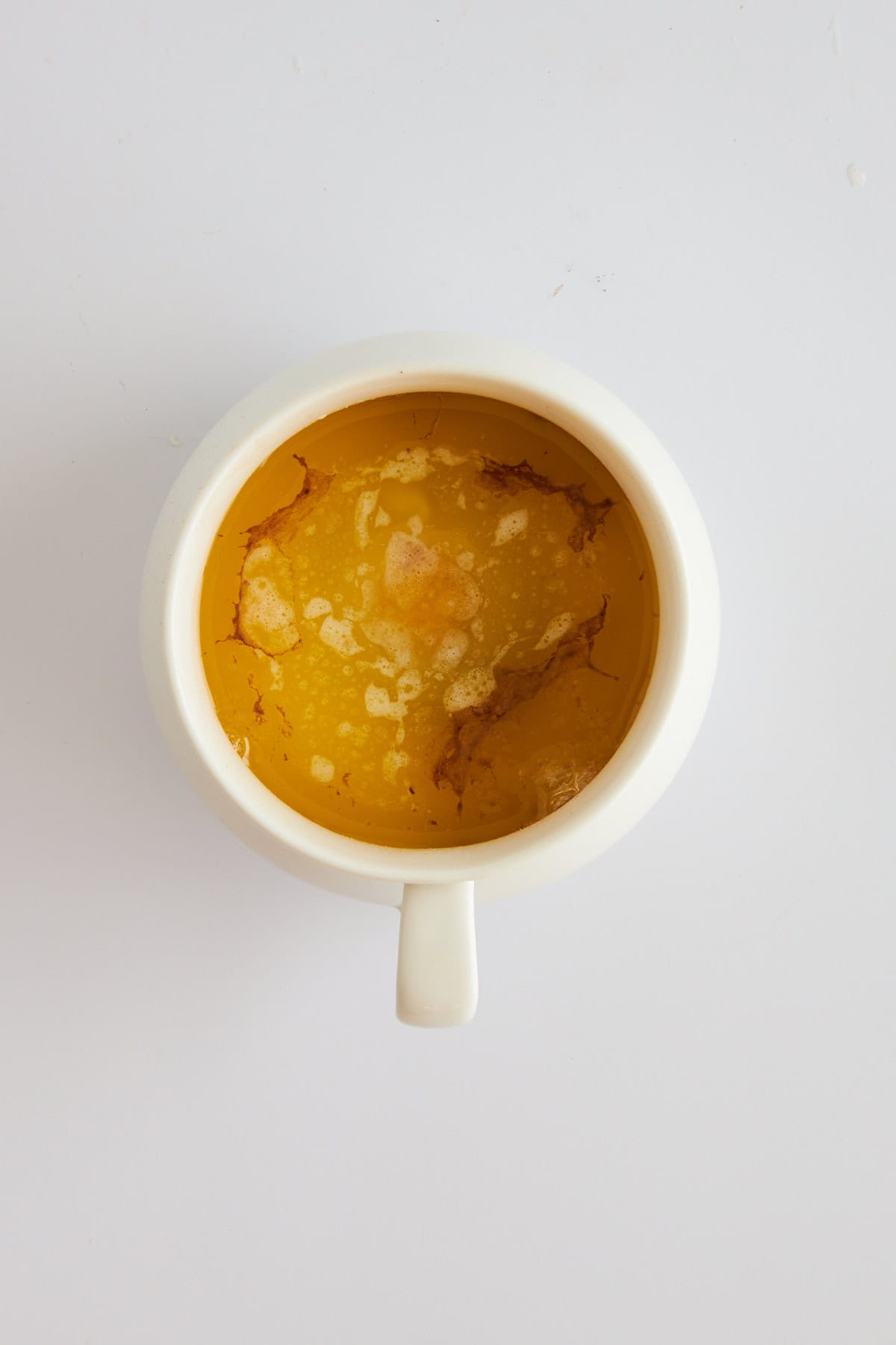 Overhead image of an uncooked chocolate mug cake. 