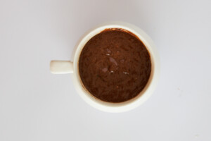 Overhead image of a cooked chocolate mug cake.