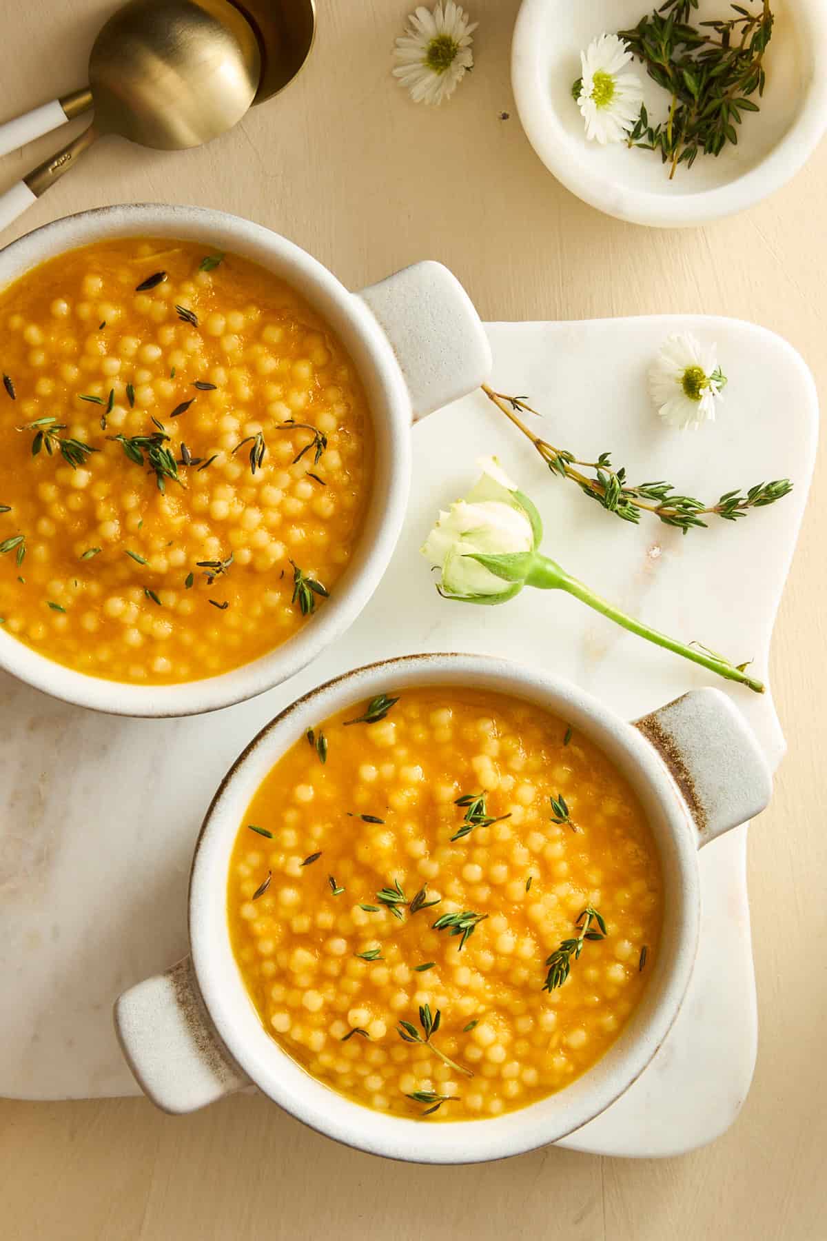 Two bowls of pastina soup.