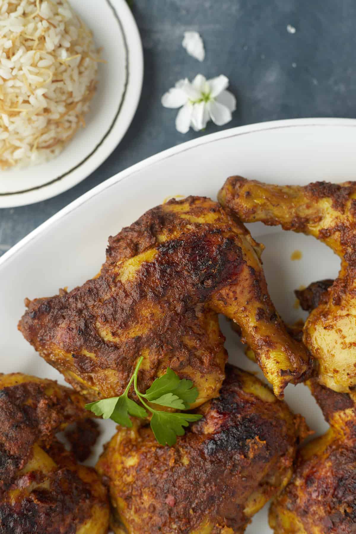 a plate full of baked Middle Eastern chicken legs