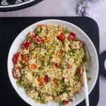 a bowl of couscous salad with chicken