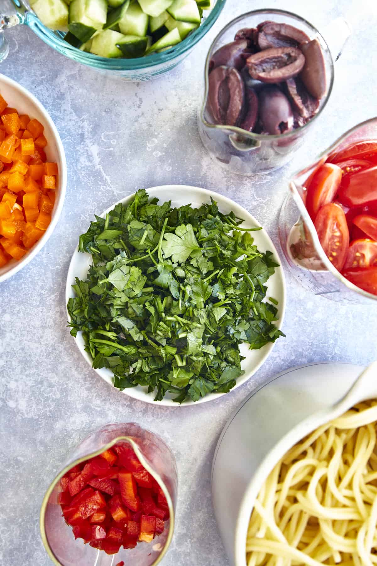 https://www.fooddolls.com/wp-content/uploads/2023/04/Greek-Spaghetti-Salad15696.jpg