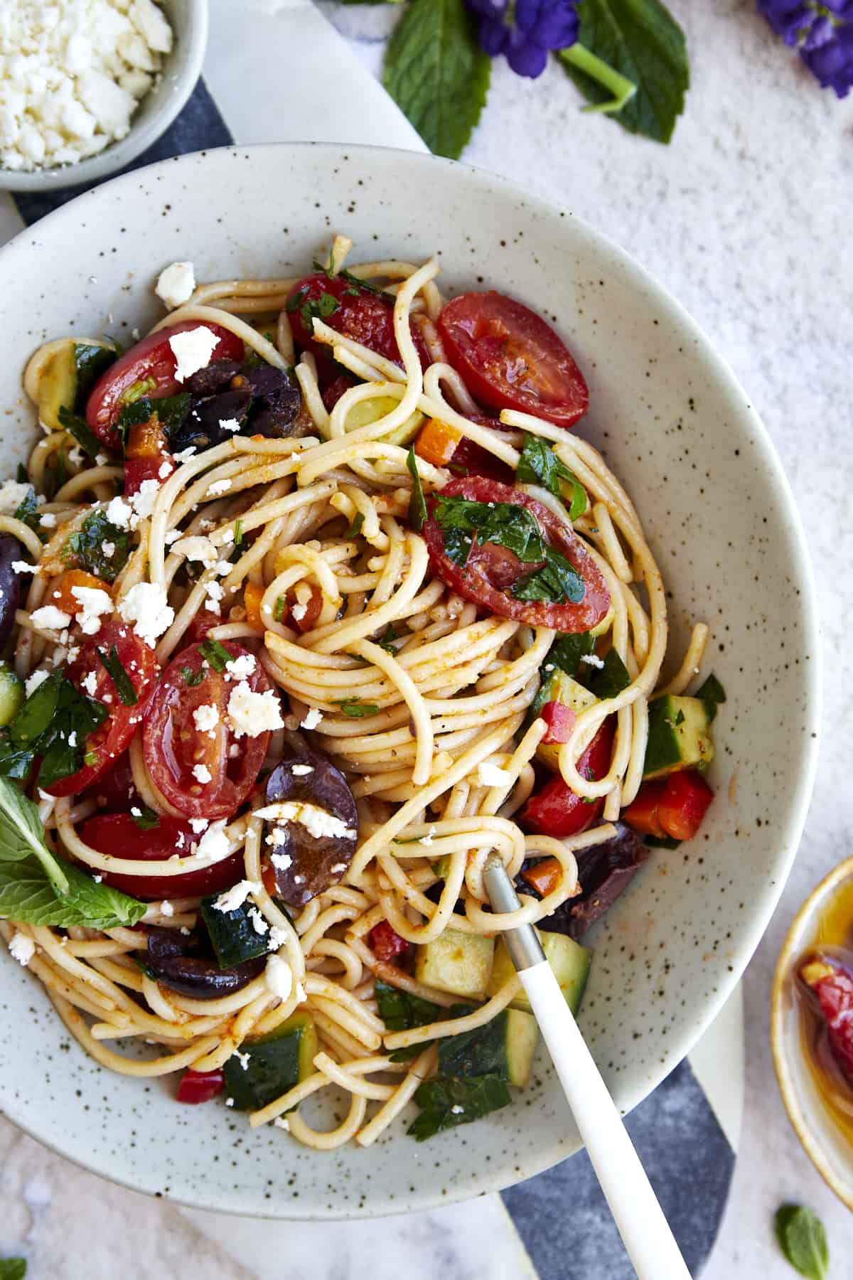 https://www.fooddolls.com/wp-content/uploads/2023/04/Greek-Spaghetti-Salad15717.jpg