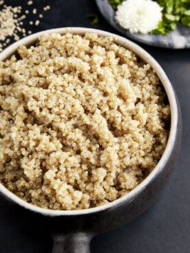 A bowl of fluffy, cooked quinoa.