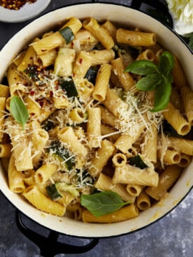 Overhead image of a pot of pasta with zucchini.