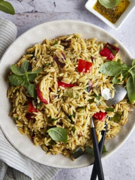 A bowl of roasted veggie pasta salad with orzo.