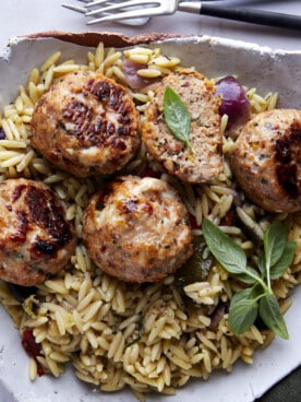 Sun-dried tomato chicken meatballs over rice.