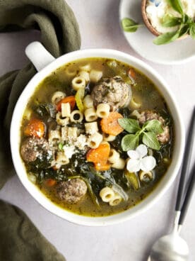 Overhead image of a bowl of Italian wedding soup.