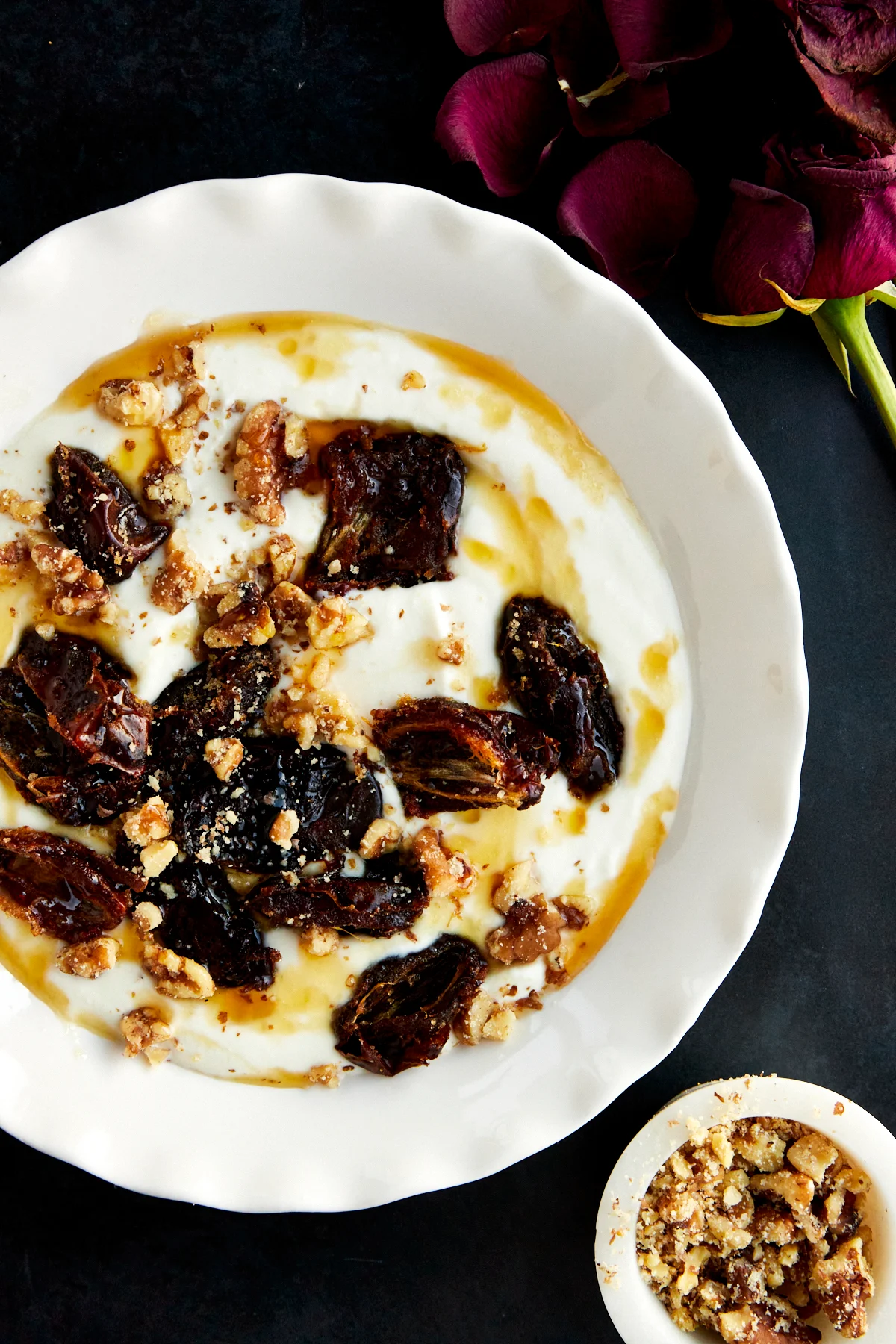 A bowl of honey whipped ricotta and roasted dates.