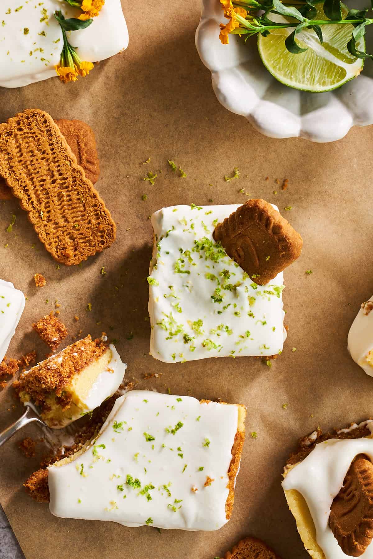 Overhead image of key lime pie bars topped with Biscoff cookies.
