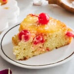 A slice of easy pineapple upside down cake on a plate.