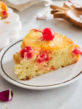 A slice of easy pineapple upside down cake on a plate.