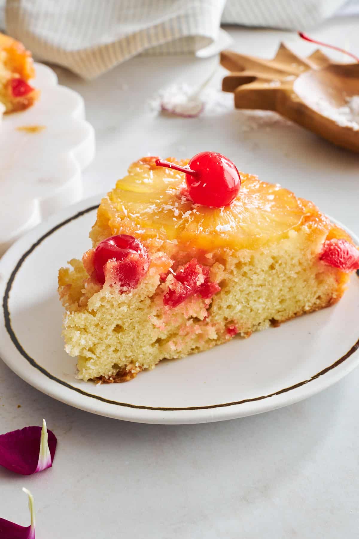 A slice of easy pineapple upside down cake on a plate.