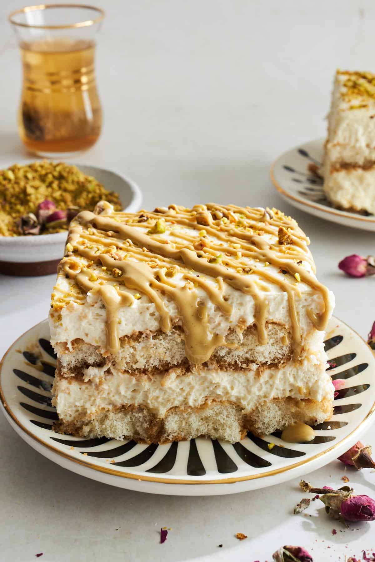 A slice of pistachio tiramisu on a plate.