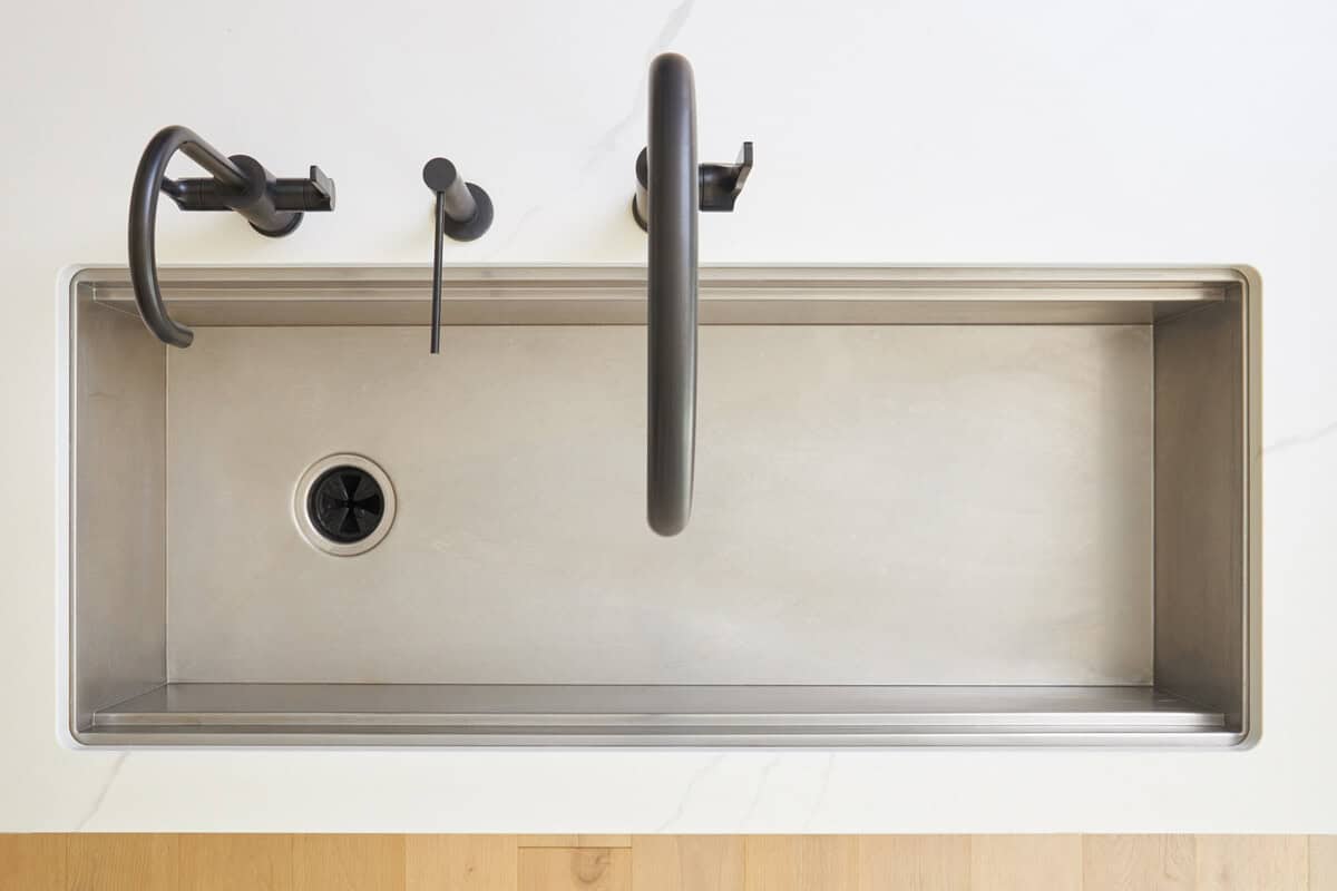 Overhead image of a clean kitchen sink. 