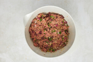 Mediterranean ground beef meatball mix in a bowl.