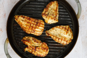 Chicken breasts on a grill pan.