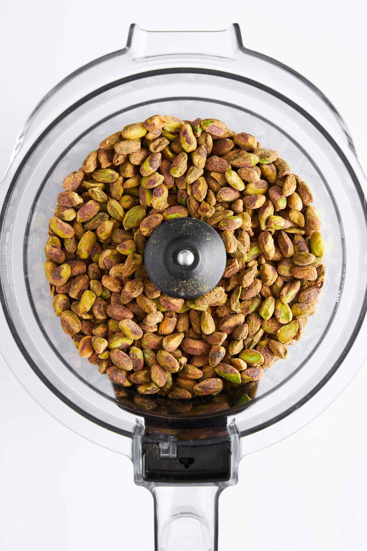 Shelled pistachios in a food processor. 