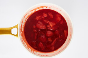 Strawberry sauce in a saucepan.