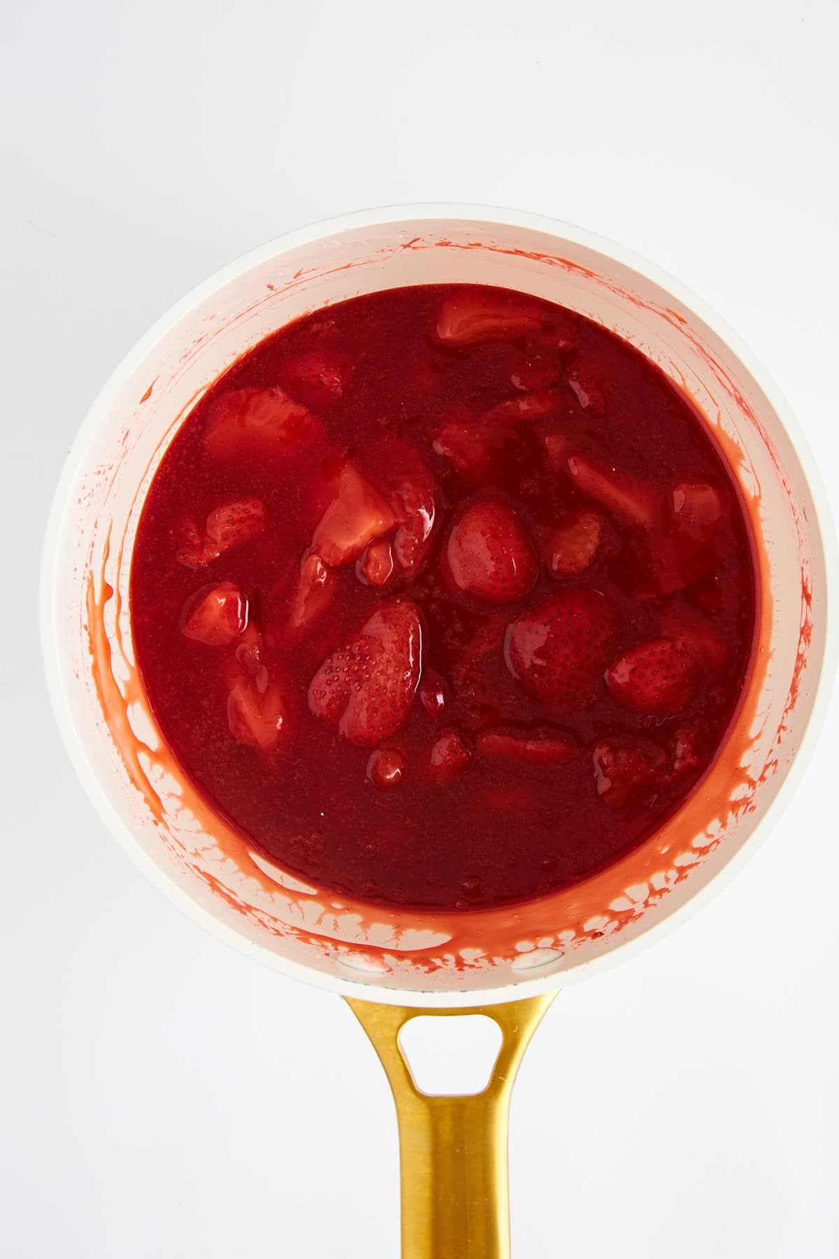 Strawberry sauce in a saucepan.