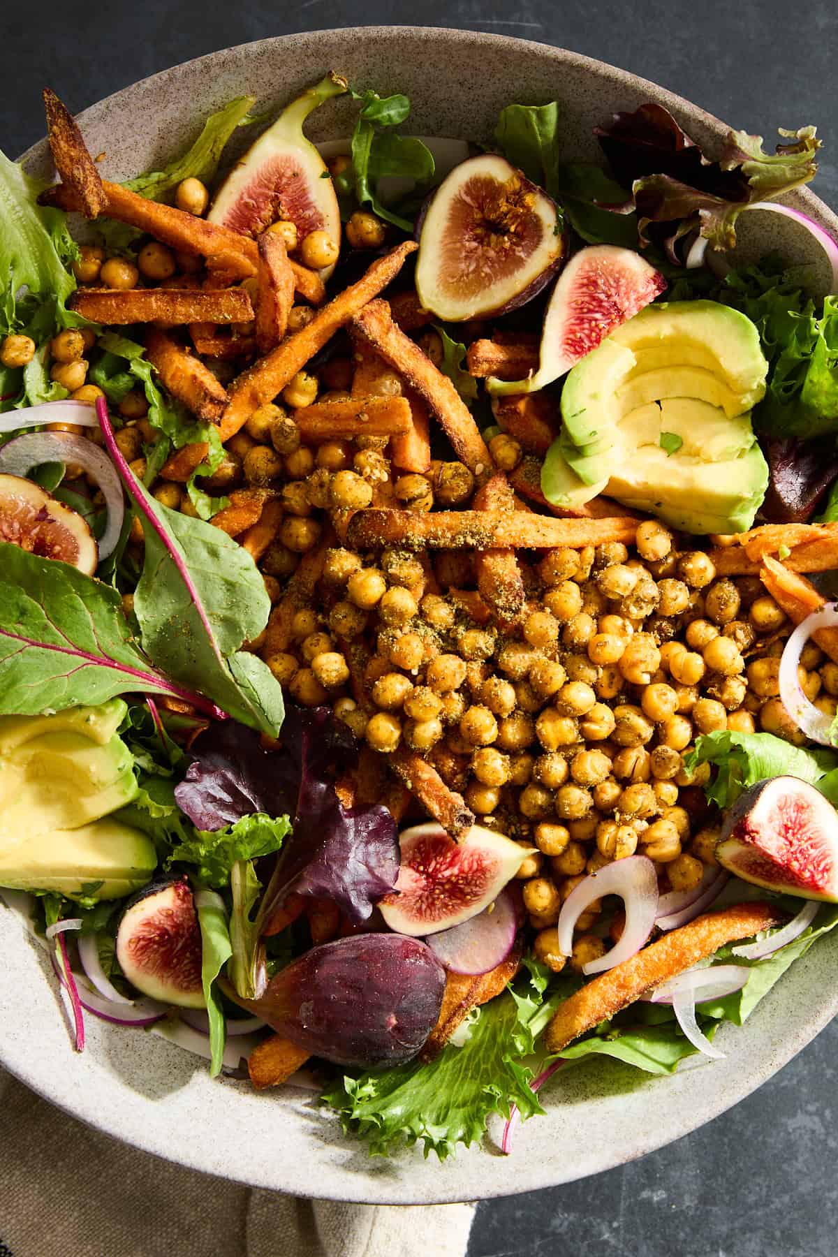 Close up image of an Roasted Carrots Chickpea Fig Salad without dressing. 