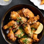 A bowl of parmesan garlic chicken wings.