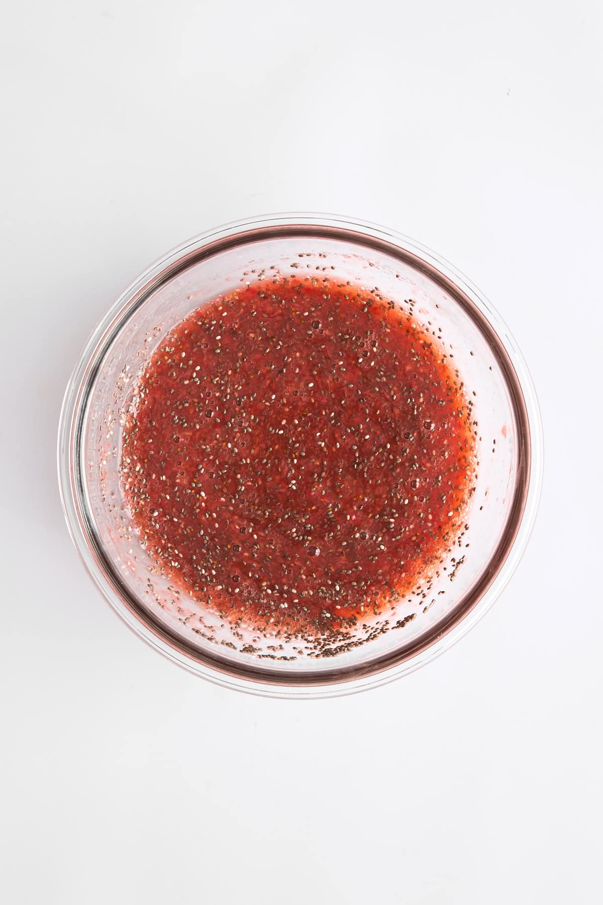 Strawberry chia pudding mixture in a bowl. 