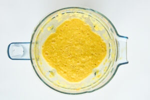 Blended ginger and turmeric shots in a blender.