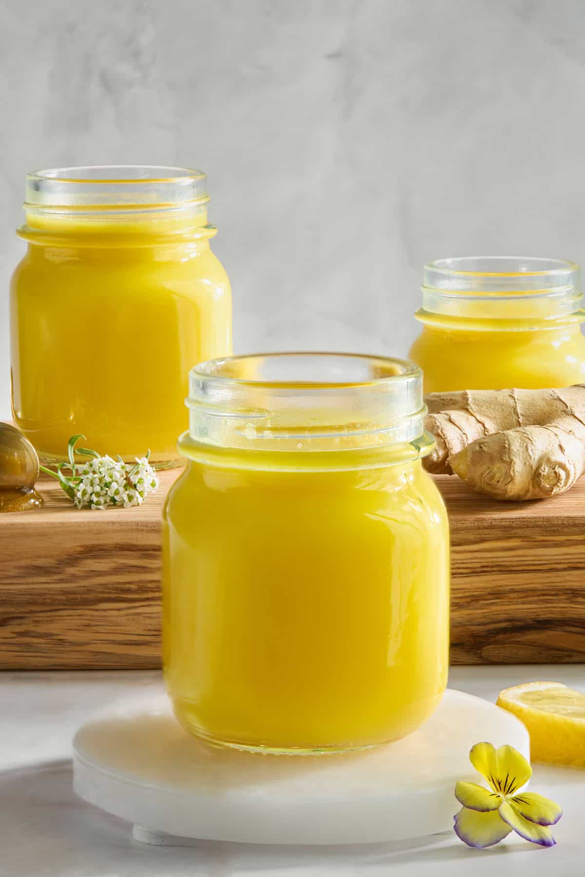 Three jars of ginger turmeric shots.