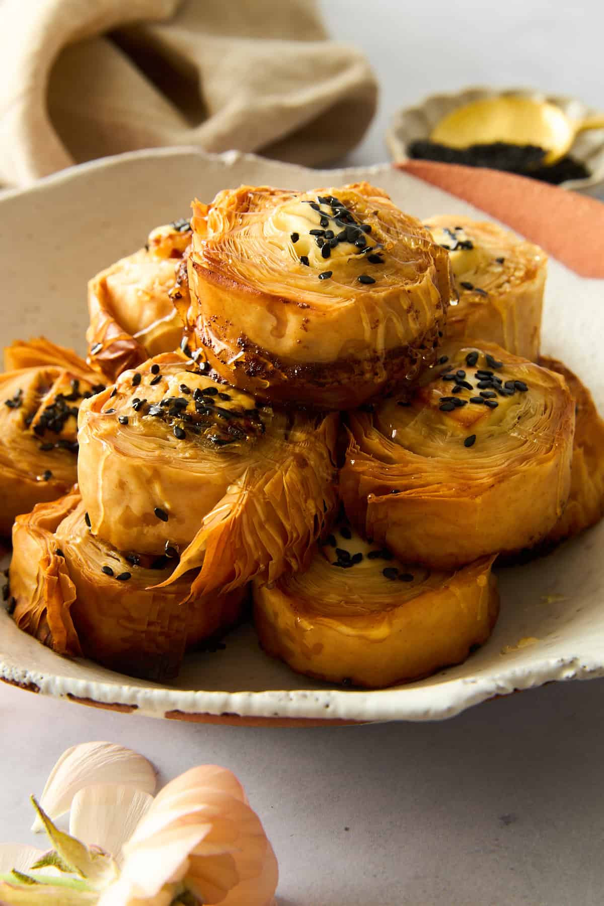 A plate of Hot Honey Feta Phyllo Rolls. 