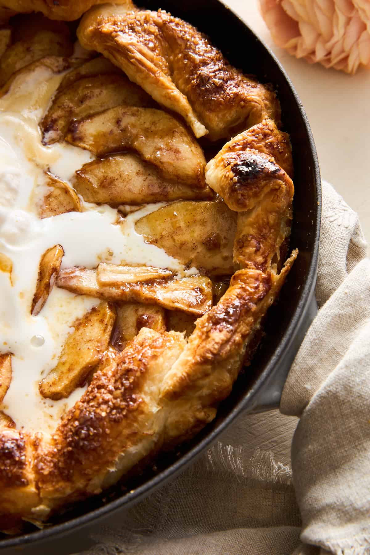 Close up image of Apple Galette with Puff Pastry topped with ice cream and caramel. 