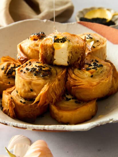 A plate of hot honey phyllo rolls.