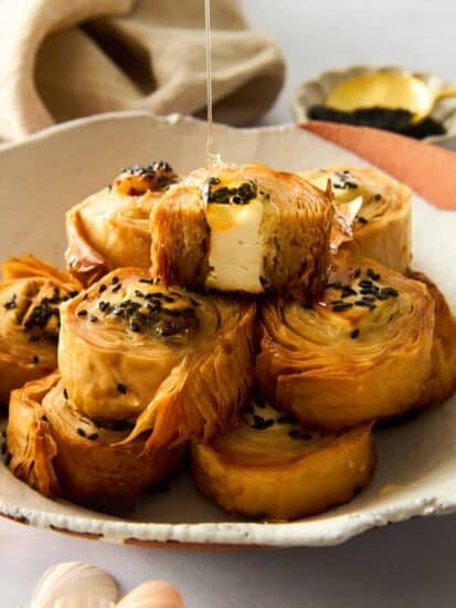 A plate of hot honey phyllo rolls.