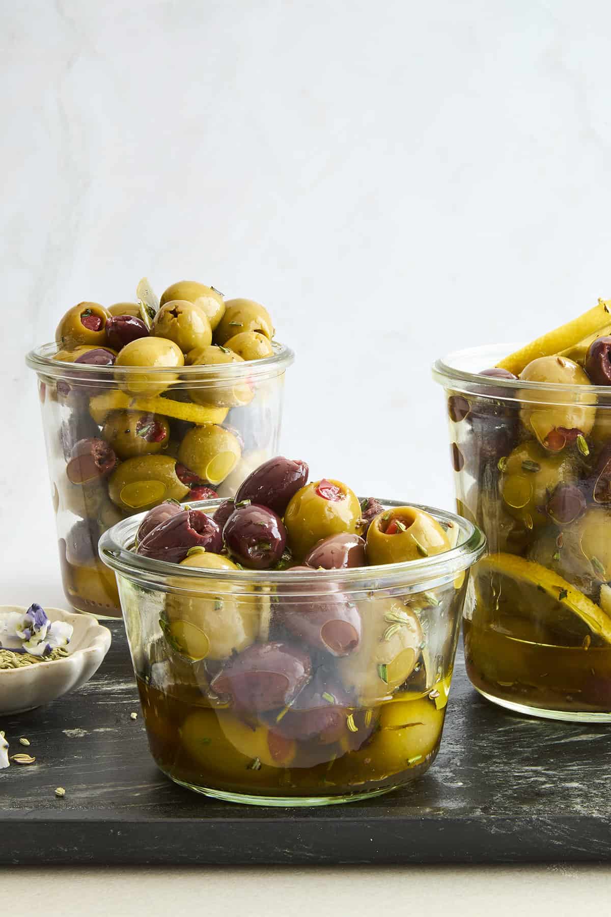 Jars of green and black marinated olives. 