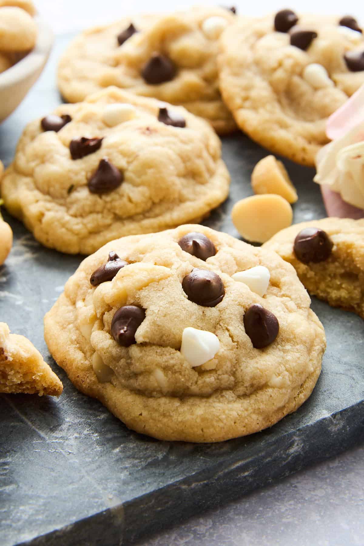 Close up image of chocolate chocolate macadamia nut cookies.