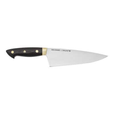 A chefs knife with a shiny stainless steel blade.