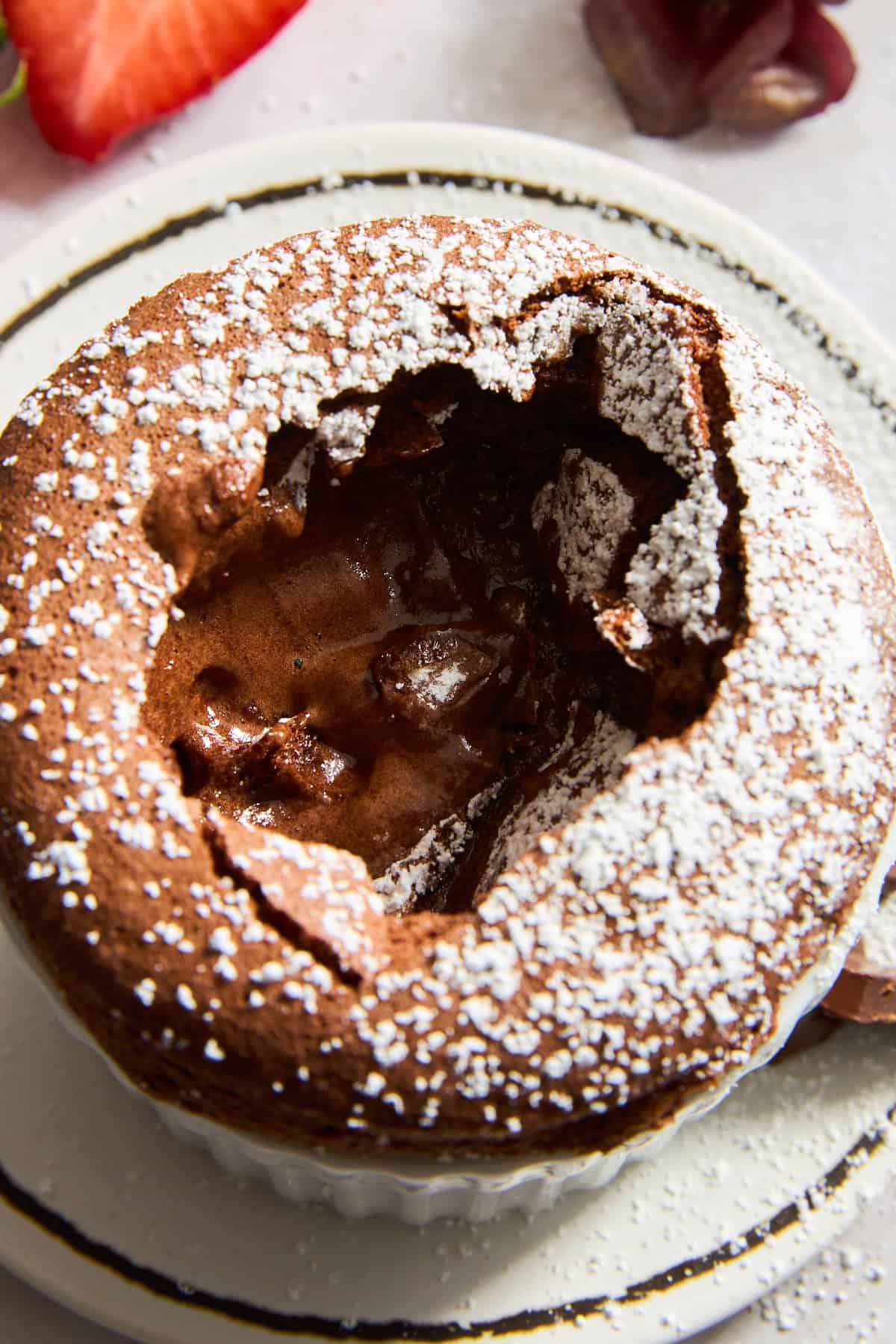 A chocolate souffle with the top cracked.