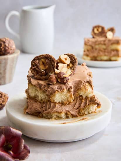 A slice of no-bake Nutella tiramisu on a plate with a bite missing.